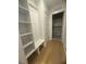 Well-organized mudroom featuring built-in storage, shelving, and bench at 60 Valebrook Ct, Youngsville, NC 27596