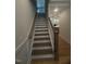 Staircase featuring hardwood treads and white risers and trim at 60 Valebrook Ct, Youngsville, NC 27596