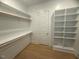 Spacious walk-in closet with built-in shelving and hardwood floors at 60 Valebrook Ct, Youngsville, NC 27596
