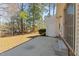 Spacious back patio extends to a lush, wooded backyard, creating a serene outdoor retreat at 613 Flaherty Ave, Wake Forest, NC 27587