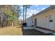 Backyard featuring a concrete patio, well-maintained lawn, and mature trees for added privacy at 613 Flaherty Ave, Wake Forest, NC 27587