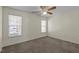 Bedroom featuring a ceiling fan and dual windows offering ample natural light at 613 Flaherty Ave, Wake Forest, NC 27587