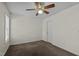 Bright bedroom featuring a ceiling fan, neutral walls, and a cozy carpet at 613 Flaherty Ave, Wake Forest, NC 27587