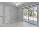 Bright dining room with sliding glass doors and modern flooring provides a tranquil space at 613 Flaherty Ave, Wake Forest, NC 27587