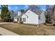 Charming single-Gathering home with white siding, landscaped yard, and an attached garage at 613 Flaherty Ave, Wake Forest, NC 27587