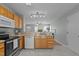 Functional kitchen with modern appliances seamlessly connects to the inviting living space at 613 Flaherty Ave, Wake Forest, NC 27587