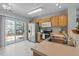 Well-equipped kitchen with stainless steel appliances and sliding glass doors to the patio at 613 Flaherty Ave, Wake Forest, NC 27587