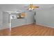 Open living space showcases seamless flow into kitchen with backyard access and updated flooring at 613 Flaherty Ave, Wake Forest, NC 27587