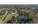 Aerial view of a neighborhood with community pool, lake, and wooded areas at 690 Hawthorne Pl, Creedmoor, NC 27522
