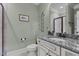 Bathroom featuring vanity with granite countertop, white toilet and fixtures at 690 Hawthorne Pl, Creedmoor, NC 27522