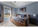 Comfortable bedroom with a daybed, a large window, and stylish decor at 690 Hawthorne Pl, Creedmoor, NC 27522
