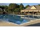 Beautiful community pool with lounge chairs and covered seating area at 690 Hawthorne Pl, Creedmoor, NC 27522