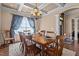 Formal dining room with beautiful chandelier, coffered ceilings, and plenty of room for guests at 690 Hawthorne Pl, Creedmoor, NC 27522