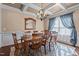 Formal dining room featuring a chandelier, coffered ceilings, and ample natural light at 690 Hawthorne Pl, Creedmoor, NC 27522