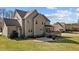Beautiful exterior of a two-story home with a well-maintained lawn and outdoor patio at 690 Hawthorne Pl, Creedmoor, NC 27522