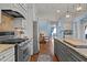 Well-appointed kitchen features stainless steel appliances and a center island, blending functionality and style at 690 Hawthorne Pl, Creedmoor, NC 27522