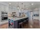 Open kitchen featuring a large island with seating and stainless steel appliances at 690 Hawthorne Pl, Creedmoor, NC 27522