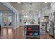 Spacious kitchen with an island, stainless steel appliances, and hardwood flooring at 690 Hawthorne Pl, Creedmoor, NC 27522