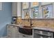 Close-up of a kitchen sink with copper farmhouse sink and granite countertops at 690 Hawthorne Pl, Creedmoor, NC 27522