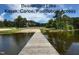 Beautiful Beaverdam Lake showing kayak, canoe and paddleboat access via wooden dock at 690 Hawthorne Pl, Creedmoor, NC 27522