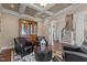 Inviting living room with coffered ceilings, elegant decor, and staircase at 690 Hawthorne Pl, Creedmoor, NC 27522