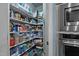 Organized pantry with ample shelving and stainless steel oven at 690 Hawthorne Pl, Creedmoor, NC 27522