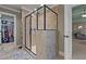 Modern shower with tiled walls, dual shower heads, and glass enclosure at 690 Hawthorne Pl, Creedmoor, NC 27522