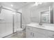 Bright bathroom with a glass-enclosed shower and quartz countertops at 720 Shell Bank Ct, Cary, NC 27519