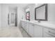 Bathroom with double vanity, granite countertops, modern fixtures, and a large mirror at 720 Shell Bank Ct, Cary, NC 27519