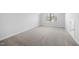 Light-filled bedroom with neutral walls and carpet at 720 Shell Bank Ct, Cary, NC 27519