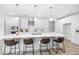 Modern kitchen featuring white cabinets, a large center island, stainless steel appliances and pendant lighting at 720 Shell Bank Ct, Cary, NC 27519