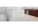 Spacious living room with neutral carpet and kitchenette at 720 Shell Bank Ct, Cary, NC 27519