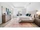 Spacious main bedroom with a tray ceiling, neutral colors, and a sitting area at 720 Shell Bank Ct, Cary, NC 27519