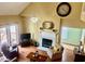 Spacious living area with fireplace and balcony access at 7710 Astoria Pl, Raleigh, NC 27612