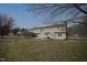 Expansive backyard with a well-maintained lawn and a view of the home's rear exterior at 8510 Polaris Dr, Bahama, NC 27503