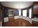 Dining room with hardwood floors, and blue wallpaper at 8510 Polaris Dr, Bahama, NC 27503
