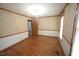 Dining room with wood floors, neutral wallpaper, chair railing, and a chandelier at 8510 Polaris Dr, Bahama, NC 27503
