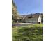 Well-maintained home with a three-car garage, a spacious driveway, and beautiful landscaping at 8510 Polaris Dr, Bahama, NC 27503