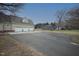Attached three car garage with a large paved driveway at 8510 Polaris Dr, Bahama, NC 27503