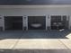 Exterior shot of a three-car garage featuring two classic cars in the open garages at 8510 Polaris Dr, Bahama, NC 27503