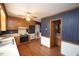 Traditional kitchen with wood cabinets, white countertops, and view to a half bathroom at 8510 Polaris Dr, Bahama, NC 27503