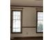 Windows providing natural light in a room with hardwood floors and neutral walls at 8510 Polaris Dr, Bahama, NC 27503