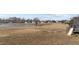 Panoramic view of the backyard, showing the pond, lawn and slide off of deck at 8712 New River Cir, Raleigh, NC 27603
