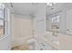 Bright bathroom featuring a tub-shower, white vanity, and a window for natural light at 8712 New River Cir, Raleigh, NC 27603