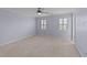 Bedroom with carpet, ceiling fan, neutral paint and plantation shutters at 8712 New River Cir, Raleigh, NC 27603