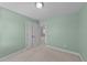 Bright bedroom featuring neutral carpet and a closet space at 8712 New River Cir, Raleigh, NC 27603