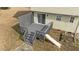 Aerial view of the deck and the home showing the screened-in portion, slide and stairs at 8712 New River Cir, Raleigh, NC 27603