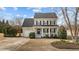 Charming two-story home with a welcoming front porch and well-manicured lawn at 8712 New River Cir, Raleigh, NC 27603