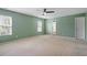 Bright bedroom with natural light streaming through windows and a modern ceiling fan at 904 Churchill Glen Blvd, Knightdale, NC 27545