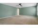 A carpeted bedroom showcasing a ceiling fan and neutral tones at 904 Churchill Glen Blvd, Knightdale, NC 27545